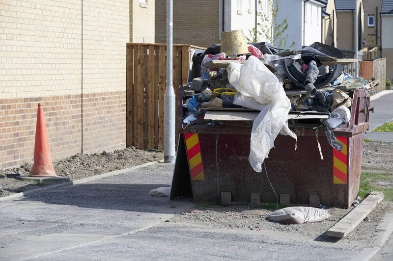 Overfilled skip bin safety hazard